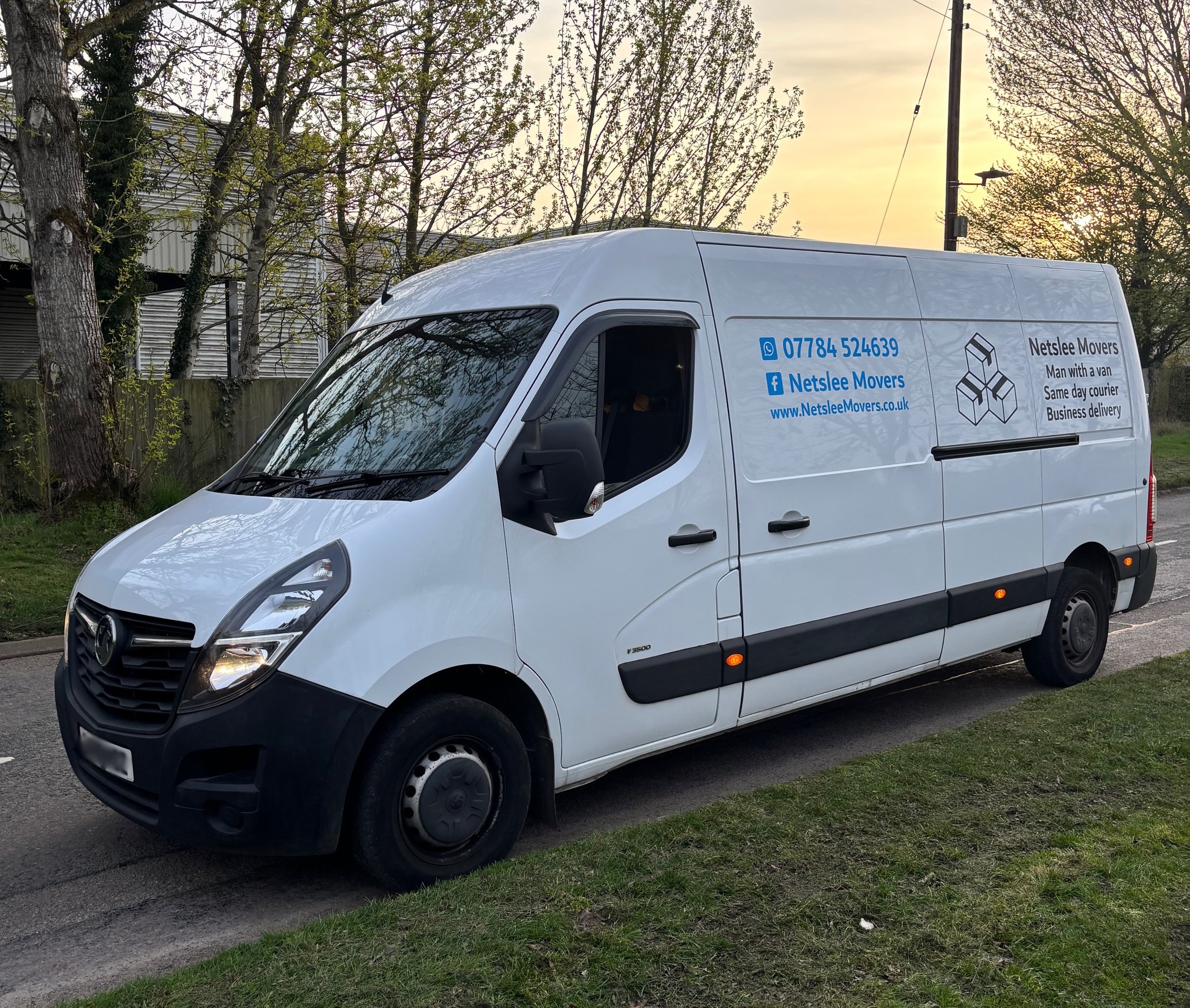 Side view of Netslee Movers courier van showing spacious cargo area